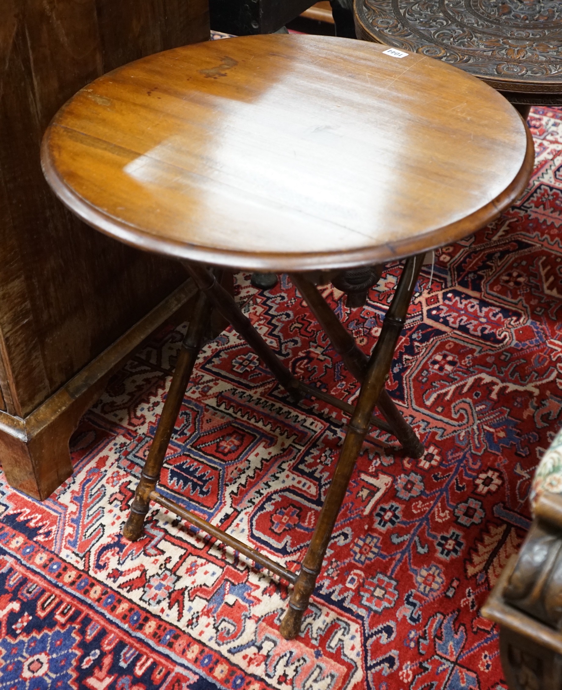 An early 20th century circular beech folding occasional table on faux bamboo underframe, diameter 60cm, height 70cm